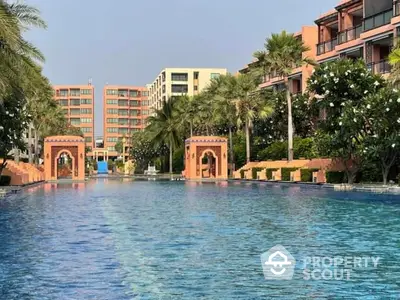 Luxurious resort-style pool with palm trees and elegant architecture