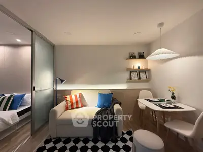Modern living room with cozy sofa, stylish dining area, and ambient lighting