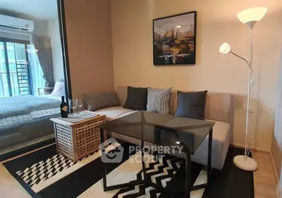 Modern living room with stylish decor and cozy seating area in a contemporary apartment.