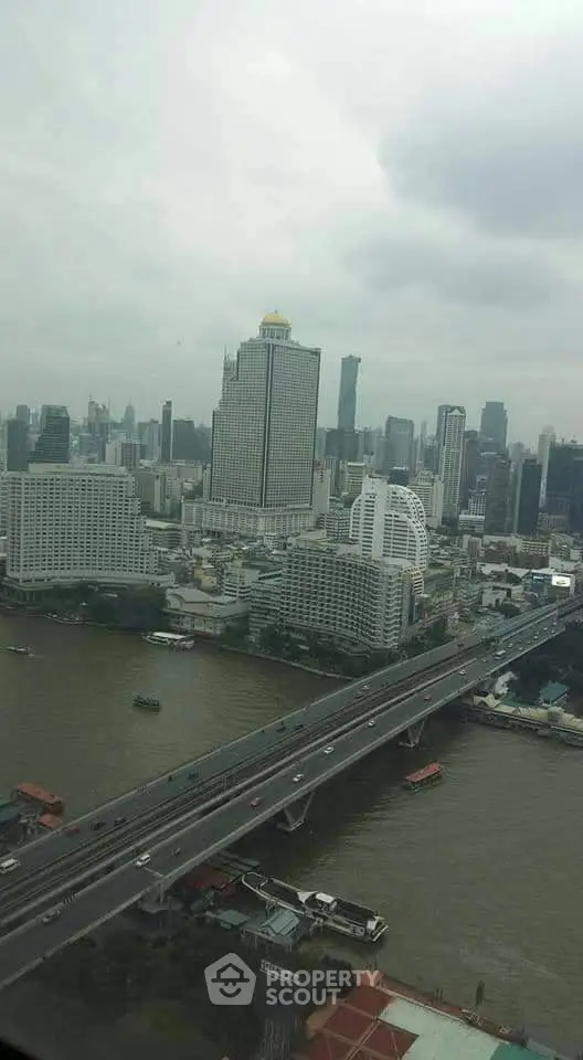 Stunning cityscape view with river and skyscrapers, perfect for urban living enthusiasts.