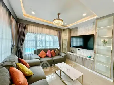 Luxurious living room with modern decor and large windows
