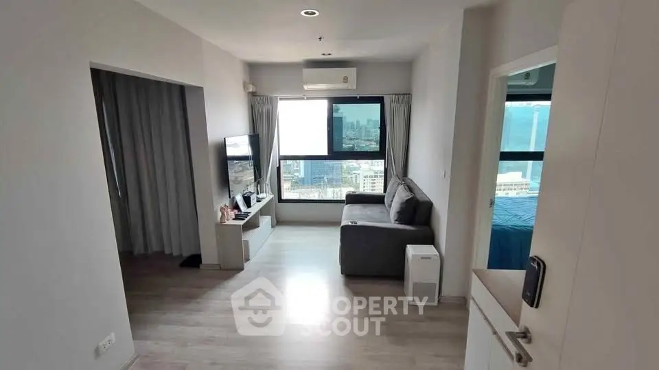 Modern living room with city view and sleek furnishings