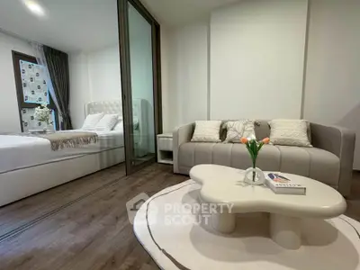 Modern studio apartment with cozy living area and stylish bedroom