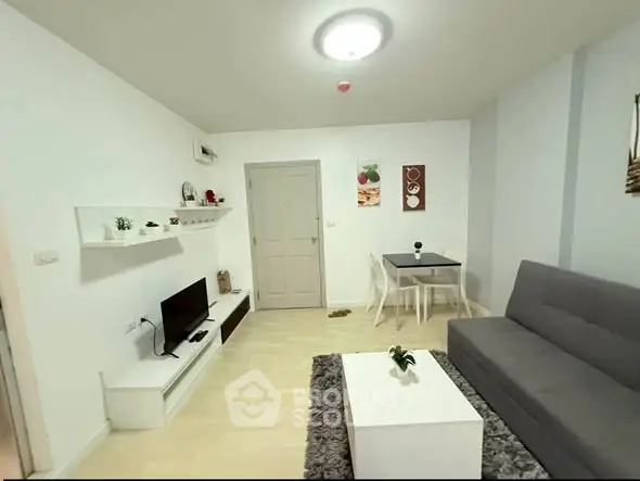 Modern living room with sleek furniture and minimalist decor, perfect for urban living.