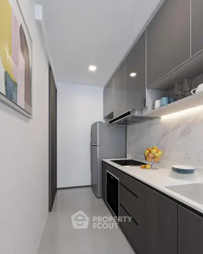 Modern kitchen with sleek cabinets and marble backsplash, featuring a compact layout and contemporary design.