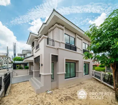 Modern two-story house with spacious yard and elegant exterior design