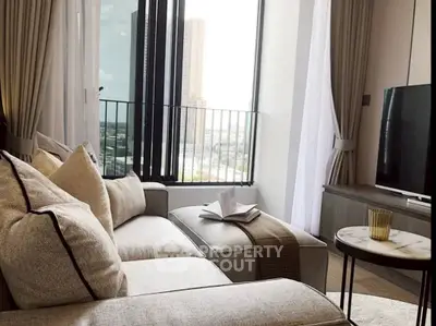 Modern living room with cozy sofa and city view from large windows