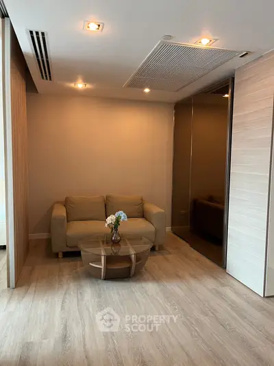 Modern living room with cozy sofa and stylish coffee table in elegant apartment.