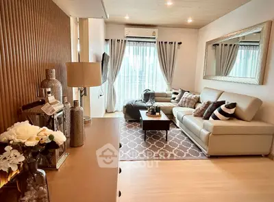 Stylish living room with modern decor, cozy seating, and elegant lighting in a contemporary home.