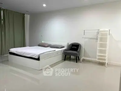 Spacious minimalist bedroom with modern furniture and sleek design