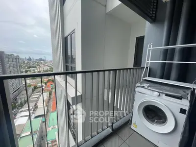High-rise balcony with city view and washing machine, perfect for urban living.