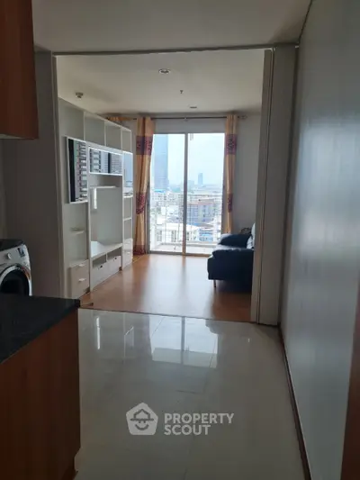 Spacious living room with city view and modern furnishings
