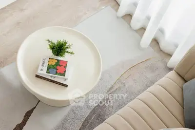 Stylish living room with modern decor and cozy seating area.