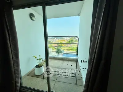 Spacious balcony with stunning city view, perfect for relaxation and enjoying the outdoors.