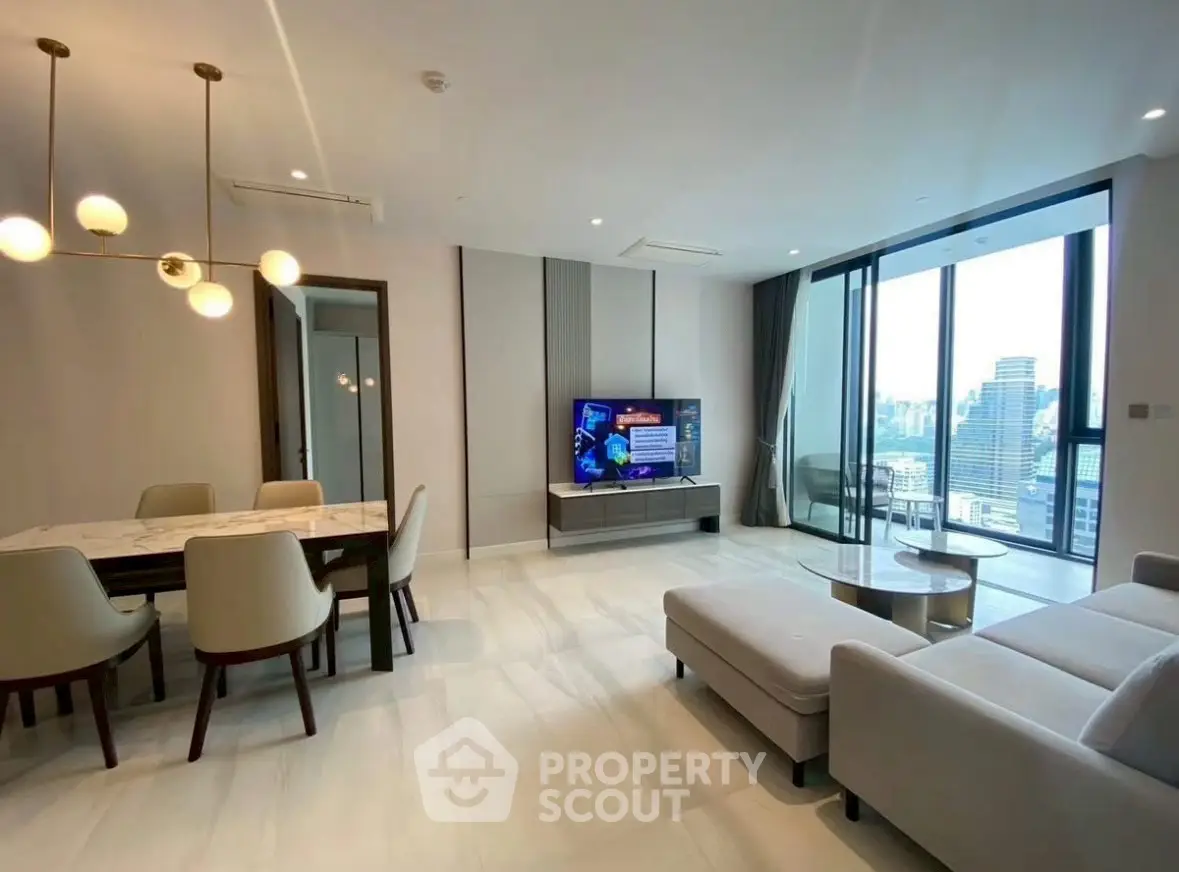 Spacious modern living room with city view, elegant dining area, and stylish furniture.
