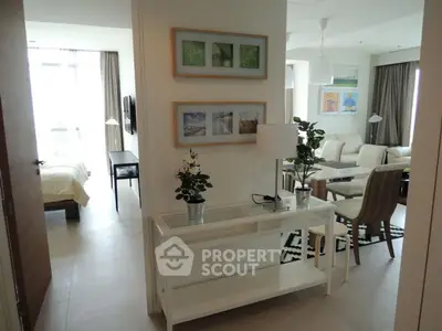 Modern open-plan living room with stylish decor and natural light