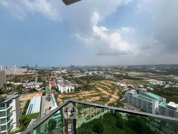 Stunning panoramic city view from high-rise balcony, perfect for urban living.