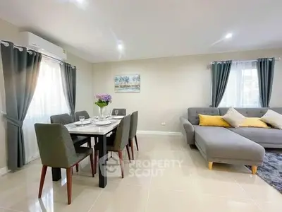 Spacious living room with modern dining area and elegant decor