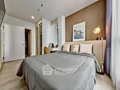 Modern bedroom with stylish decor and cozy ambiance, featuring a comfortable bed and elegant furnishings.