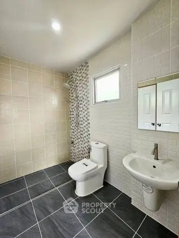 Modern bathroom with sleek tiles and contemporary fixtures