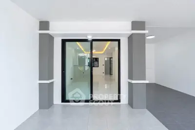 Modern minimalist interior with sliding glass doors and sleek design