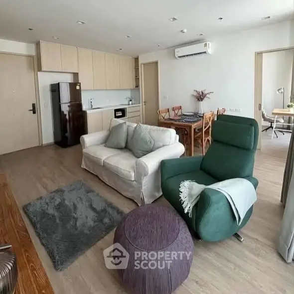 Spacious modern living room with open kitchen and stylish furniture