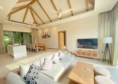 Spacious modern living room with high ceilings and open kitchen layout
