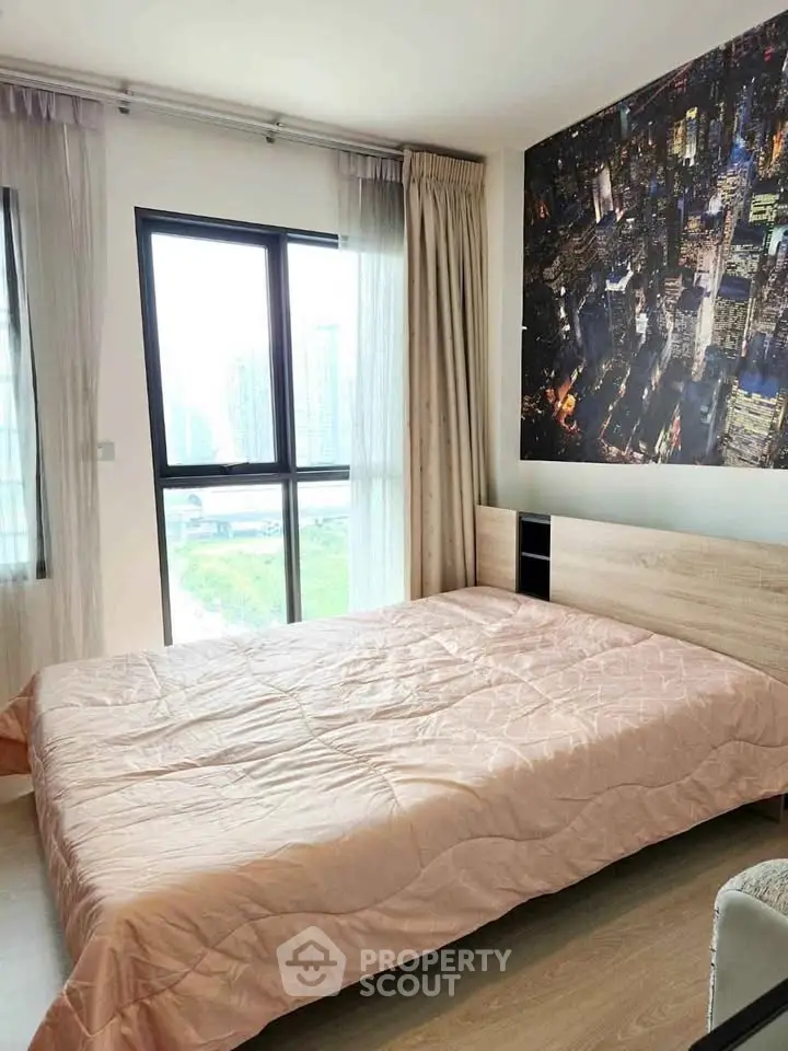 Modern bedroom with cityscape wall art and large window view