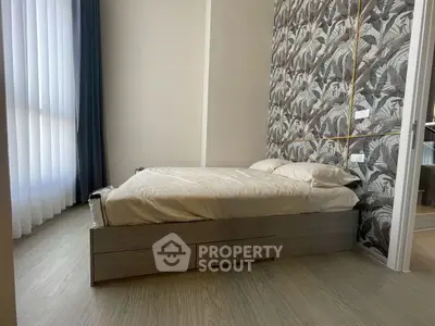 Modern bedroom with stylish wallpaper and natural light