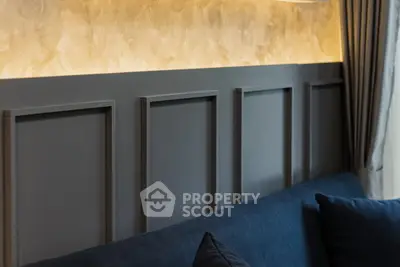 Elegant living room with modern paneling and ambient lighting