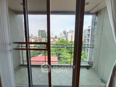 Spacious balcony with city view in modern apartment