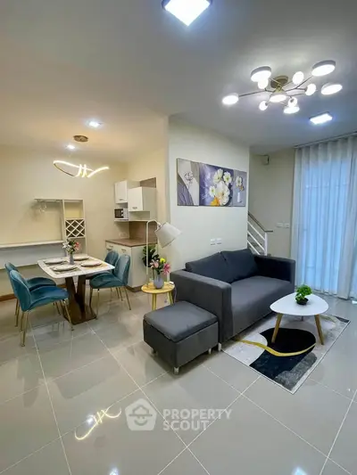 Modern living room with stylish decor and open kitchen layout