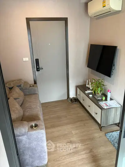 Cozy living room with modern decor and wall-mounted TV