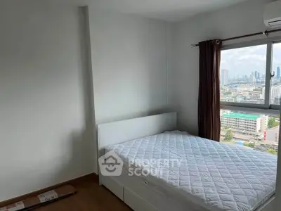 Spacious bedroom with city view in modern apartment