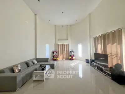 Spacious living room with high ceilings and modern decor