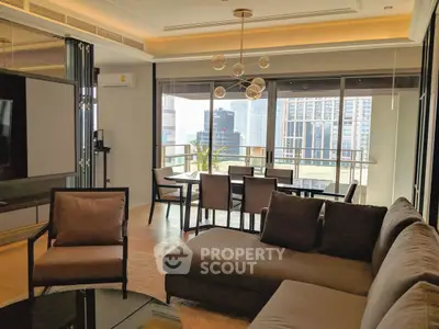 Luxurious living room with modern furniture and stunning city view, perfect for urban living.