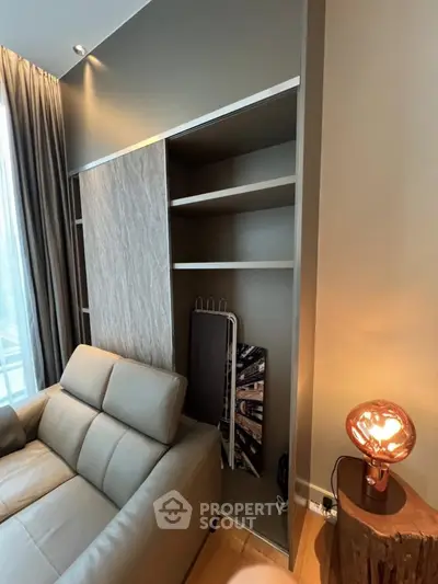 Modern living room with sleek shelving and stylish lighting