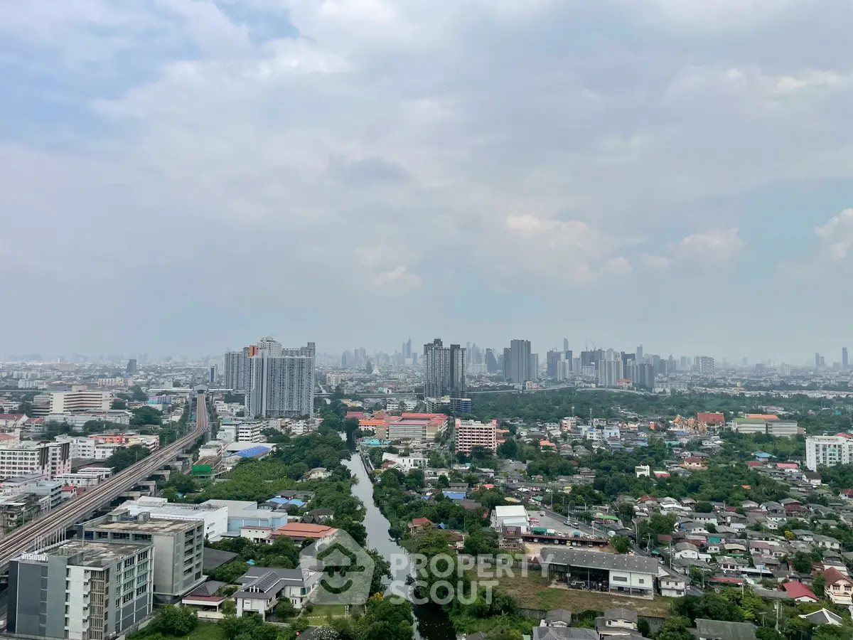Stunning cityscape view showcasing urban skyline and lush greenery, perfect for real estate investment.