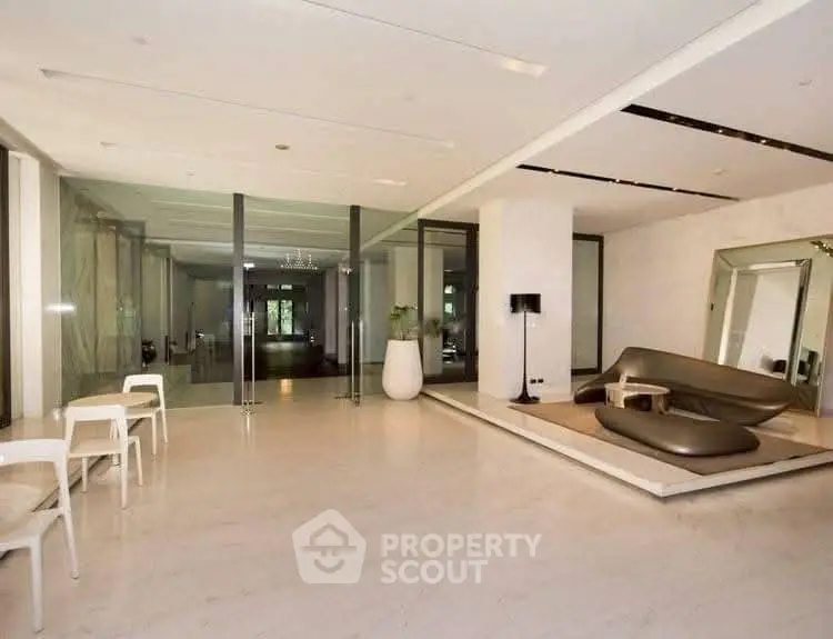 Luxurious modern living room with sleek furniture and glass doors
