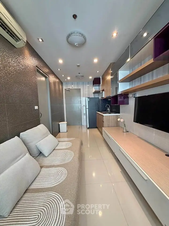 Modern living room with sleek design, open layout, and stylish furniture in a contemporary apartment.