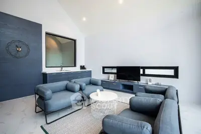 Modern living room with stylish blue furniture and sleek decor