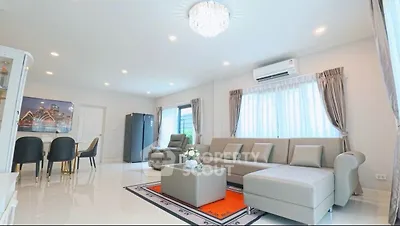 Spacious modern living room with elegant decor and ample natural light