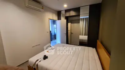 Modern bedroom with minimalist design and air conditioning in a stylish apartment