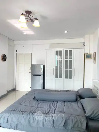 Modern bedroom with sleek design and ample storage space