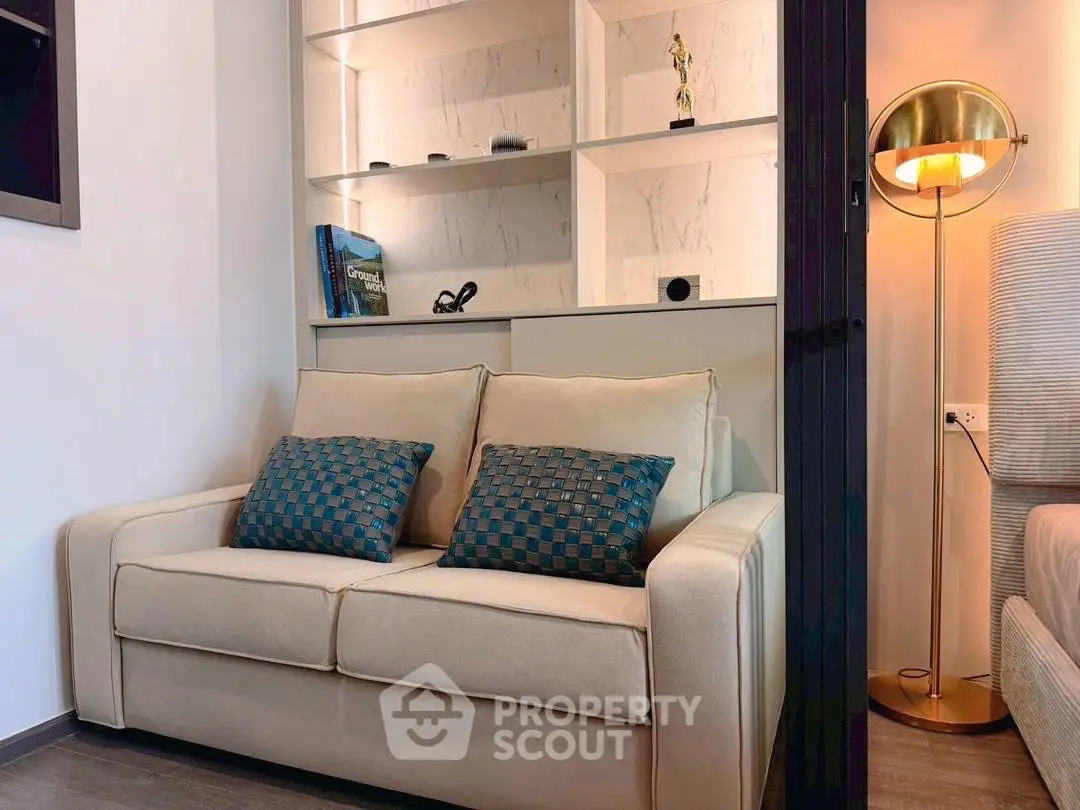 Cozy living room with elegant sofa and stylish shelving unit
