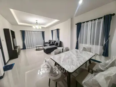 Spacious modern living room with elegant dining area and stylish furnishings