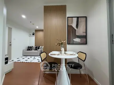 Modern apartment interior with stylish dining area and cozy living room, featuring contemporary decor and warm lighting.