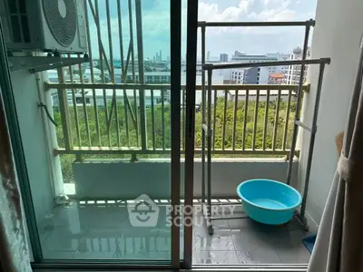 Charming balcony with city view, perfect for relaxation and enjoying the skyline.