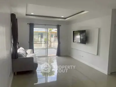 Modern living room with sleek design and large window for natural light