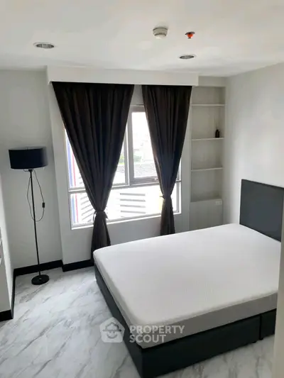 Modern bedroom with large windows and minimalist decor